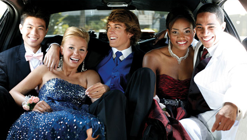Stretch limousine with prom group